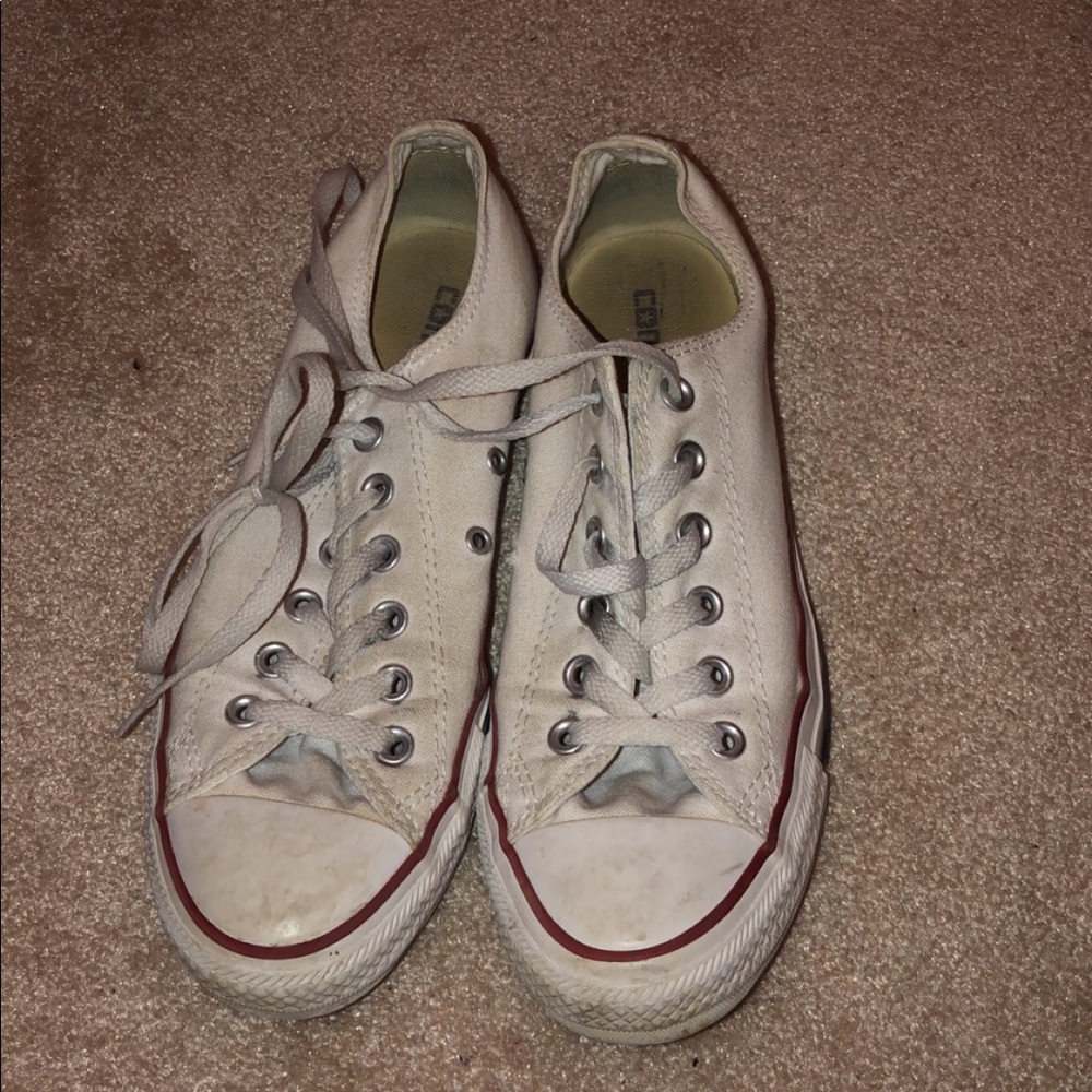 worn white low top converse